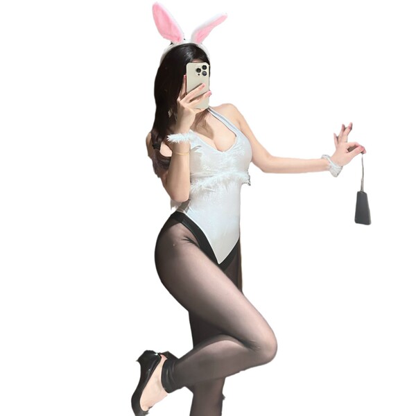 Sexy rabbit-themed costume set featuring a white bodysuit, black stockings, bunny ears headband, and playful accessories perf...