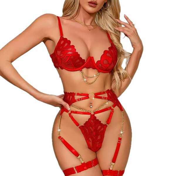 Woman wearing red lace garter belt set with intricate detailing and gold accents, showcasing sexy european-american style sha...