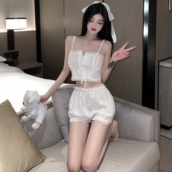 Woman wearing romantic french palace lace lingerie set with vintage-inspired sensual sleepwear and boudoir outfit, posing ele...