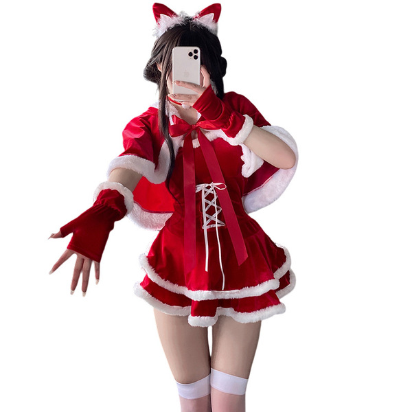 A person wearing a festive red dress with white fur trim, cat ears, gloves, and stockings, posing for a mirror selfie.