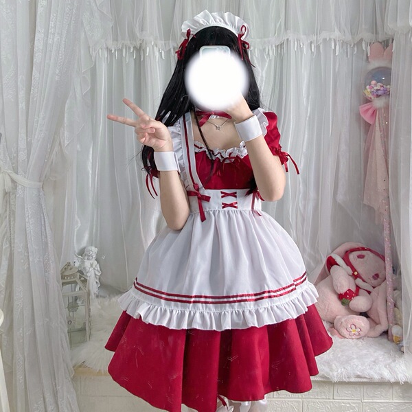 A woman poses wearing a s4xl maid costume cosplay dress, featuring a red and white lolita-style outfit with ruffles and bows....