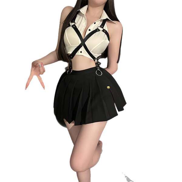 Woman wearing a sailor-themed lingerie set with a white crop top and black pleated skirt, perfect for couples passionate bedr...