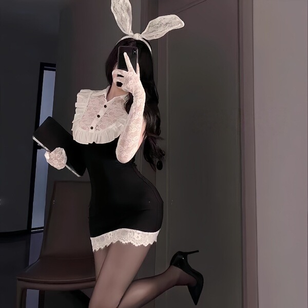 Woman in black secretary bunny girl lingerie set with white lace trim, gloves, and ears, posing seductively for role play.
