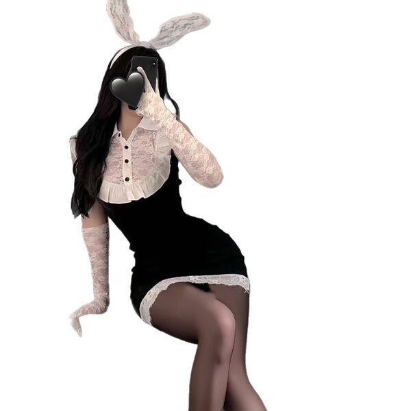 Woman in black secretary bunny girl lingerie set with white lace trim, long gloves, and bunny ears posing seductively.