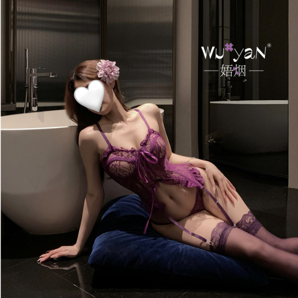 Woman in purple lace lingerie set with garters, sitting by bathtub – seductive style for small bust & roleplay.