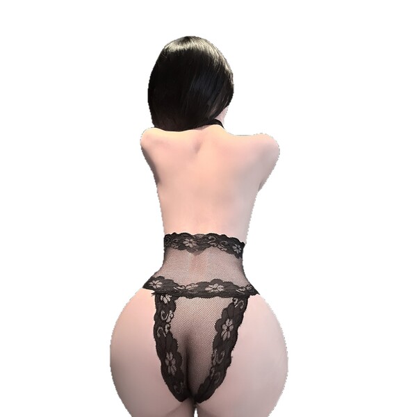 Woman wearing black lace lingerie set with sheer panels and floral detailing, back view.