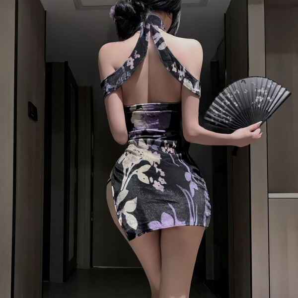 Woman in seductive lace lingerie set, a high-slit backless cheongsam dress with halter neck and floral pattern.