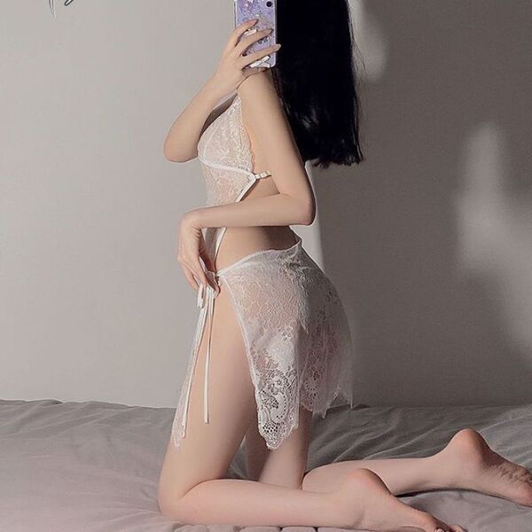 Seductive lace sleepwear set featuring sheer bodysuit with tied straps, pure temptation design.