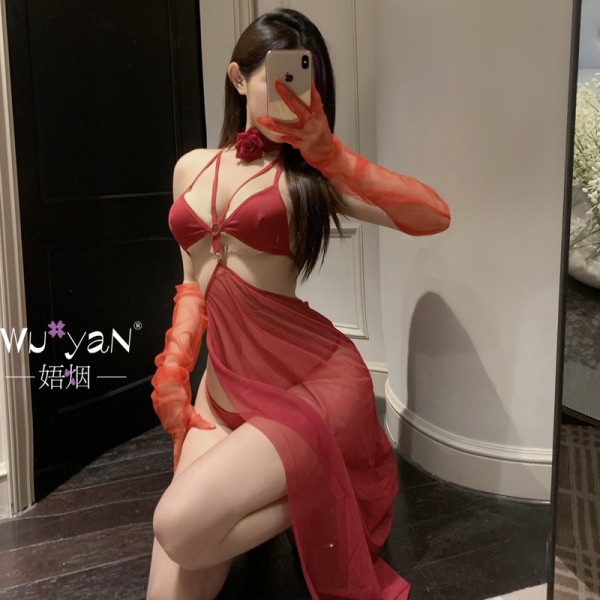 Woman posing in a red seductive lingerie set with sheer gloves and a rose choker, showcasing the pure & tempting sleepwear de...
