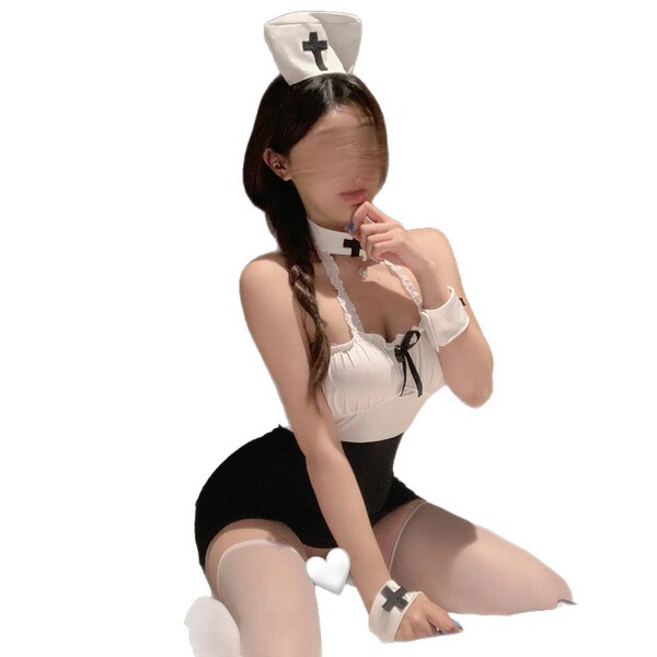Woman in seductive secretary outfit with nurse hat, white top, black skirt, and thigh-high stockings for role play.