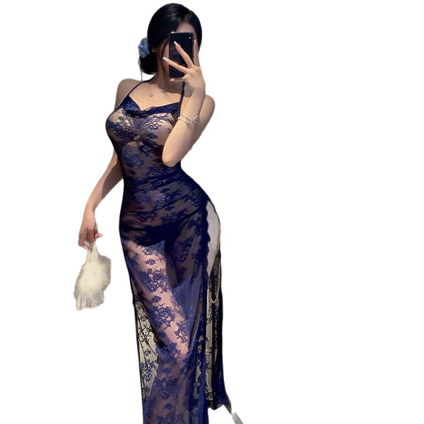 Woman in navy lace lingerie set with sheer straps, modest yet seductive design, holding white feather accessory.