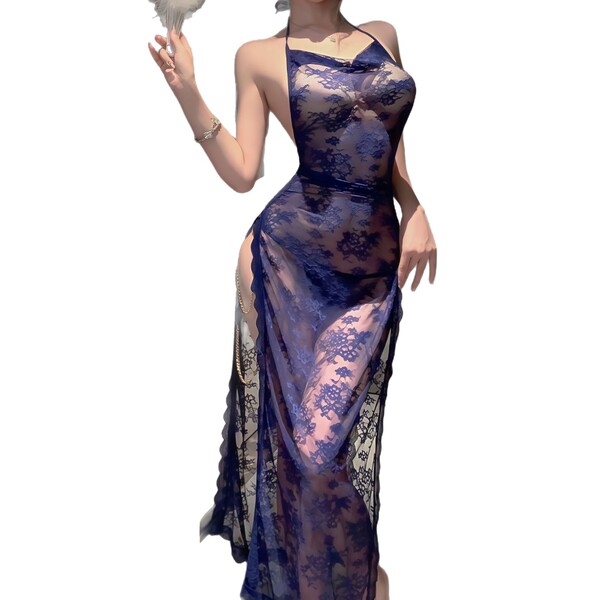 Woman in sheer blue lace lingerie set with high slit, featuring delicate straps and elegant floral patterns.
