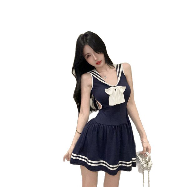 Navy schoolgirl dress with white trim and bow, sheer waist-cinching design, cute and sexy outfit.