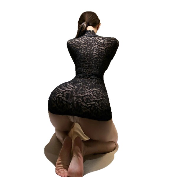 Woman kneeling in black lace bodycon corset dress with push-up effect, showcasing sensual style lingerie set from behind.