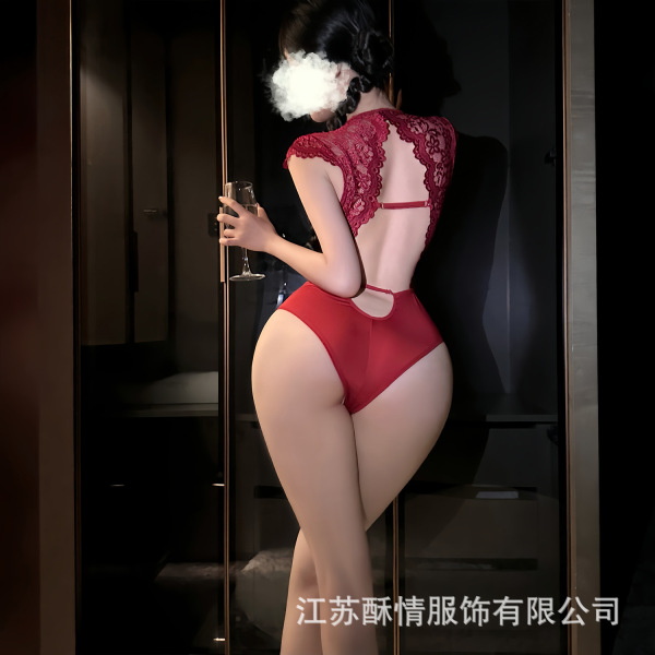 Woman wearing a red sensual lace bodysuit set with open-crotch design, holding a glass of wine.