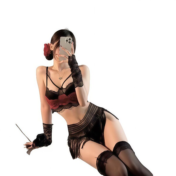 Woman wearing black and red lace lingerie set with tassels, featuring a sexy midnight outfit design for curvy women.