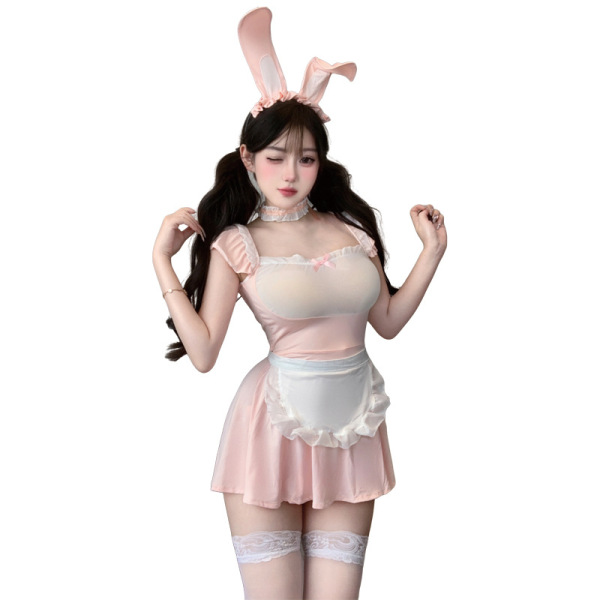 Woman in pink bunny maid costume with lace trim, sheer mesh bodice, white apron, and thigh-high stockings.