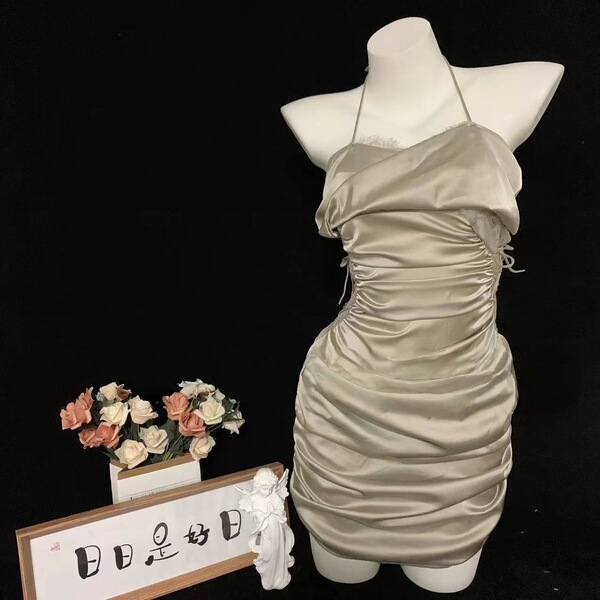 Sensual lace sleep dress with drawstring waist, displayed on mannequin. slim-fit lingerie set in soft satin finish.
