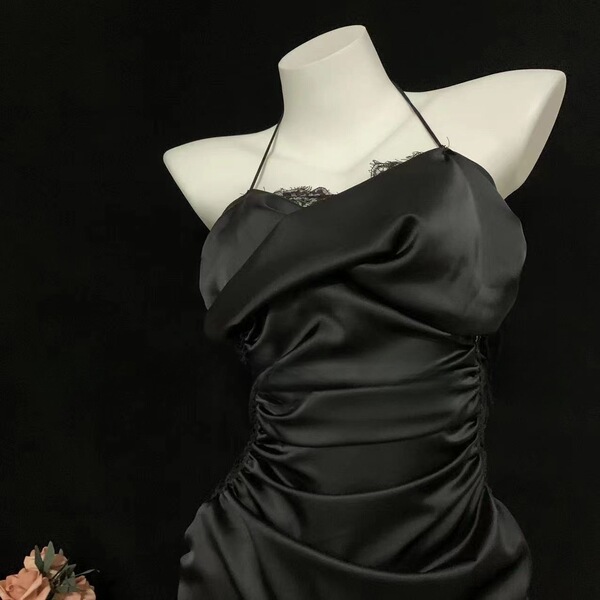 Black satin sleep dress with lace trim and drawstring waist on mannequin.
