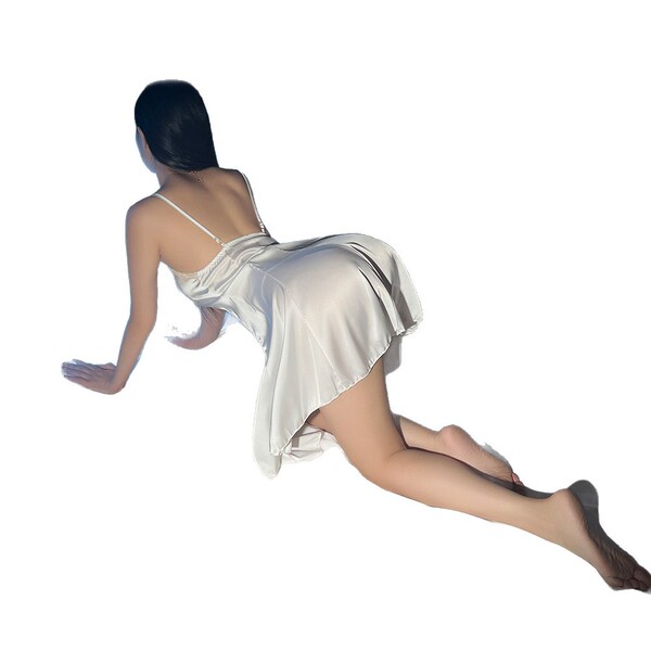Woman wearing sensual lace sleepwear set with breathable ice silk cami and shorts, pure yet alluring summer style.