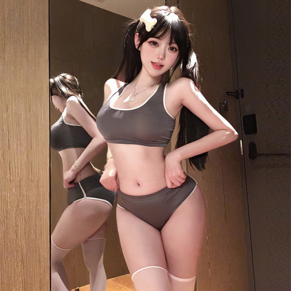 Woman modeling gray lace-trim crop top and high-waisted shorts set with white trim, sporty chic look in mirror selfie.