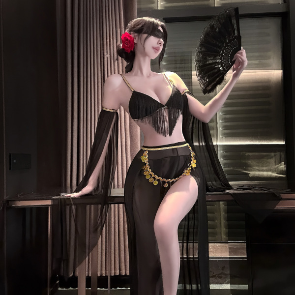 Woman in black fringe lingerie with gold accents, holding fan—luxury sensual lingerie for women, exotic boudoir set.