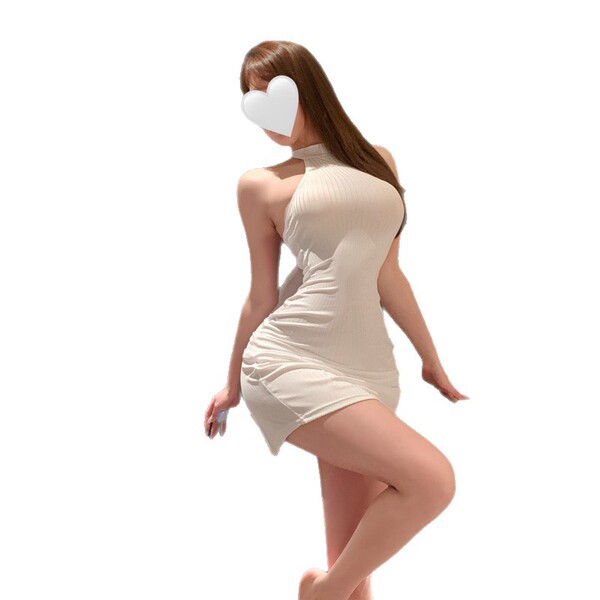 Woman wearing sensual white lingerie dress, playful and elegant design, perfect for intimate moments.