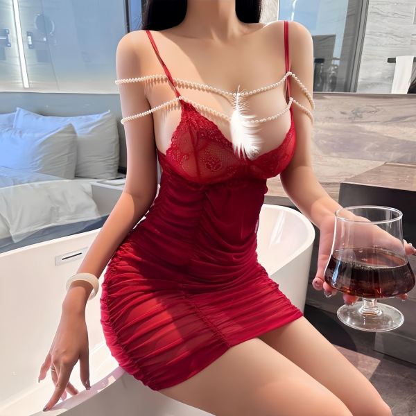 Woman in red lace chemise with pearl chains, holding wine glass by bathtub. sensual pearl-chain lace chemise – sexy qqny slee...