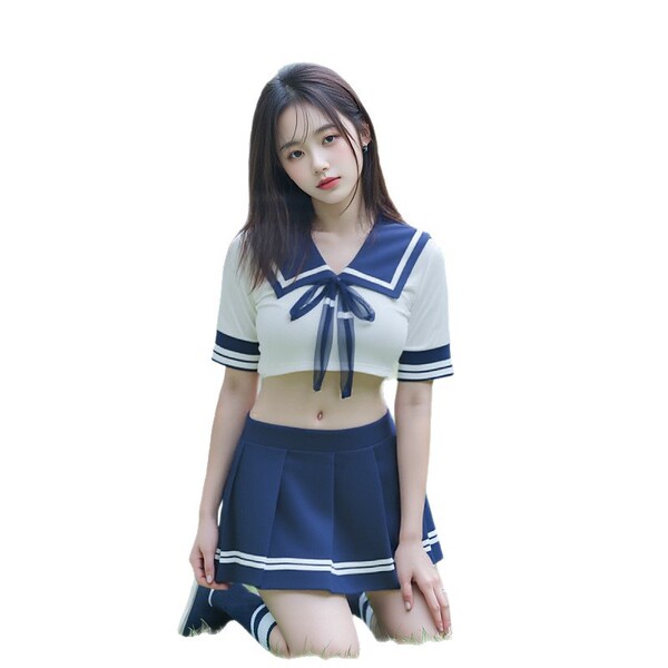 Woman kneeling in a navy and white airline-inspired skirt set with a cropped sailor top, bow detail, and pleated mini skirt.