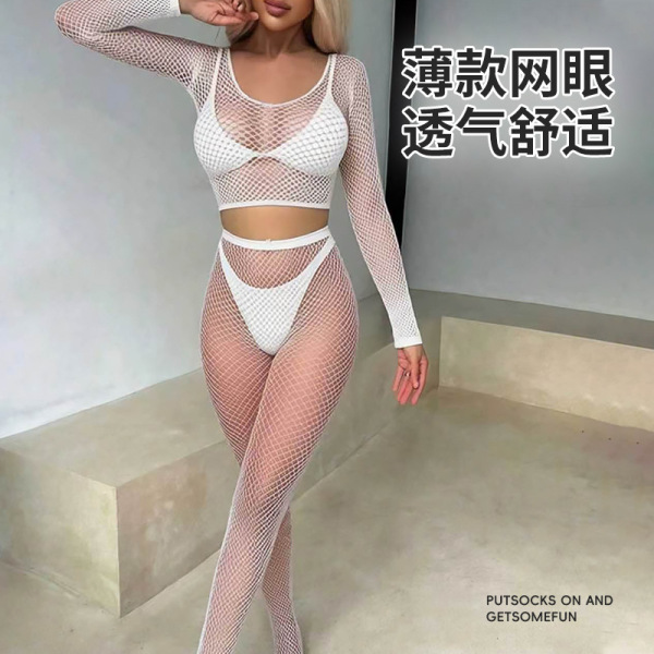 Woman modeling white sheer mesh bodystocking set with long sleeves, open-crotch design, and matching thong for sensual plus s...
