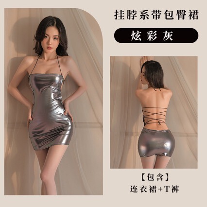 Woman modeling shiny metallic gray backless halter dress with crisscross straps; includes matching t-back skirt.