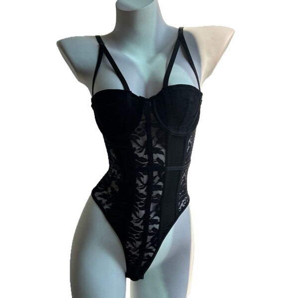Sexy backless lace bodysuit featuring sheer mesh and intricate lace design, offering elegant bodycon shapewear with delicate ...