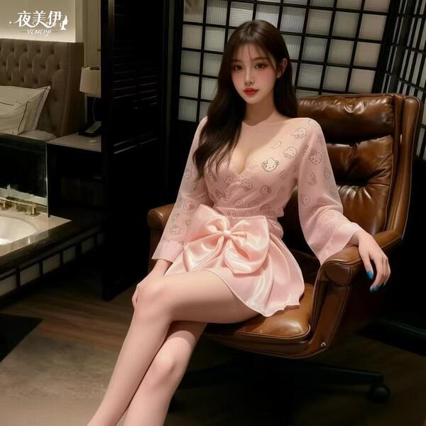A woman sits elegantly in a leather chair wearing a pink sleep dress inspired by japanese aesthetics. the dress features a pl...