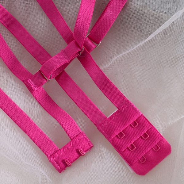Hot pink adjustable bra straps with metal clasps, part of a sexy lace bra set for women, displayed on soft white fabric.