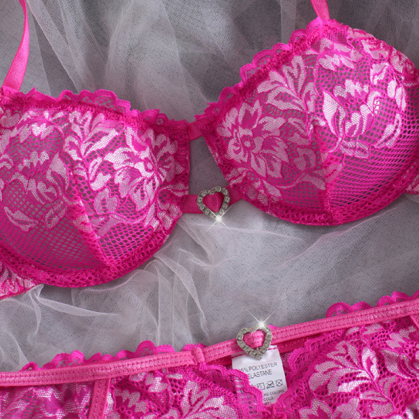 Pink lace bra and panties set with floral design, romantic plus size lingerie for women.