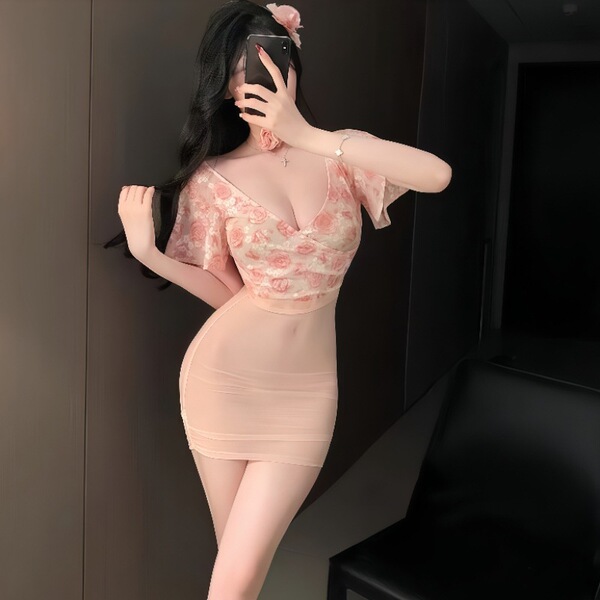Woman in pink floral lace deep v top and sheer high-waist bodycon skirt, posing with phone. plus size erotic lingerie set.