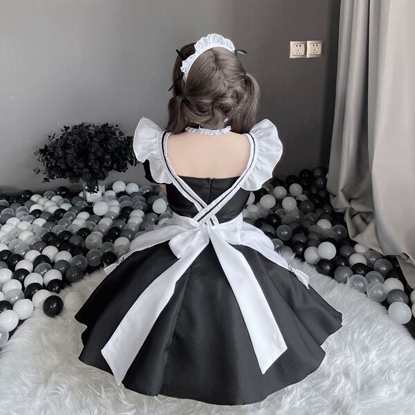 Sexy lace maid costume with cut-out details and adjustable straps, featuring a seductive apron design for adults.