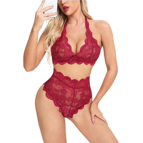 Woman modeling a red lace lingerie set featuring a halter bra and high-waist briefs.