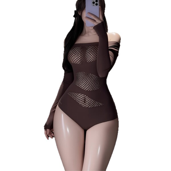 Woman wearing brown sheer mesh bodysuit with cut-outs, taking mirror selfie.