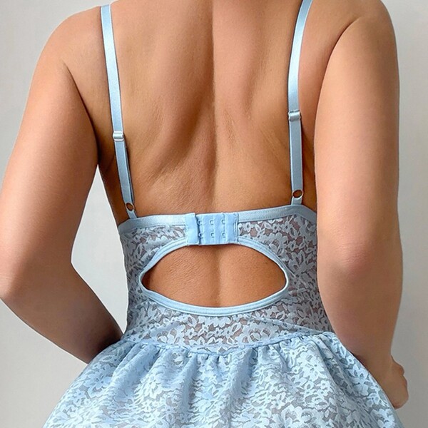 Back view of light blue lace push-up bra set with delicate straps and romantic cutout design for women.