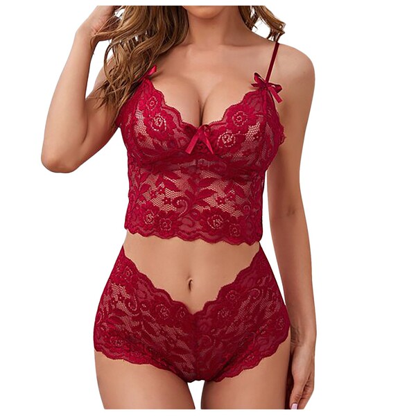 Woman wearing red lace camisole set with adjustable wrap bra and thong lingerie, showcasing style design.