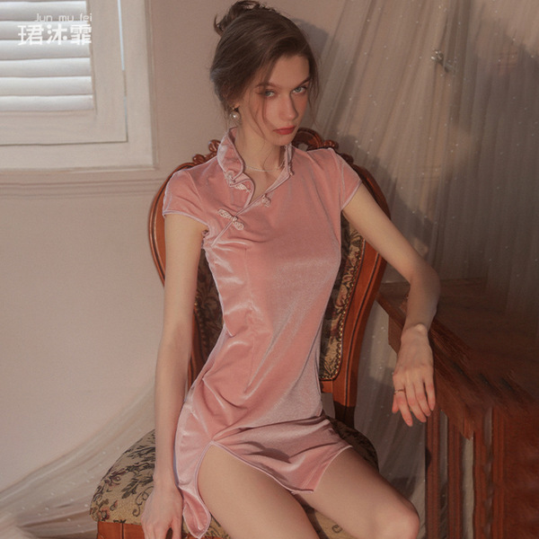 Elegant pink cheongsam sleep dress featuring lace trim, high slit, and cut-out details for plus-size allure.