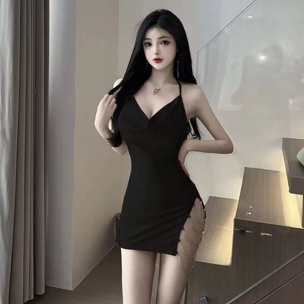 Sexy black bodycon slip dress featuring side slit, chain detail, and backless design, perfect for plus-size women.