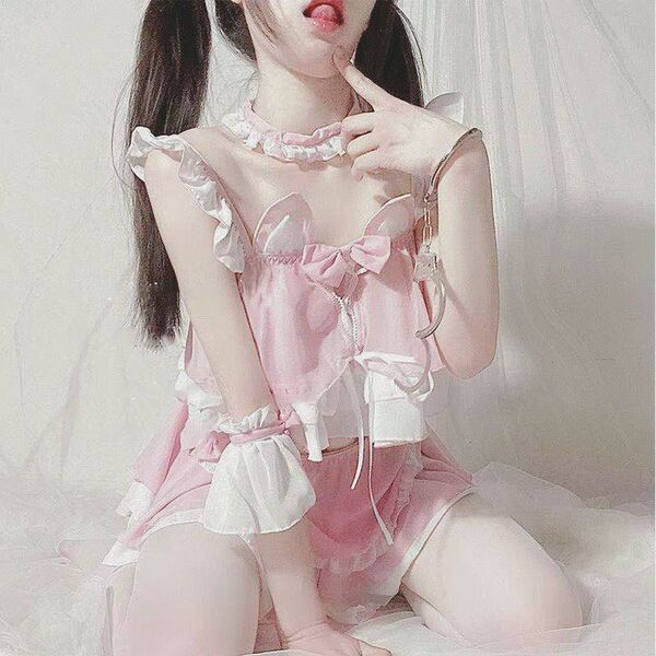 Sexy maid costume for women featuring cute pink sleepwear with ruffles and bows, perfect for seductive bedroom outfits.