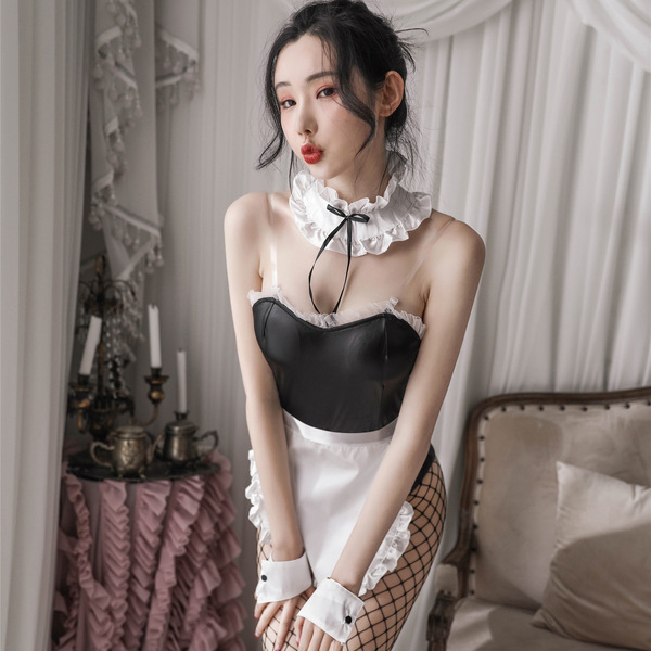 Woman wearing a sexy maid costume with pvc leather bunny girl outfit, featuring a black and white design with lace details.