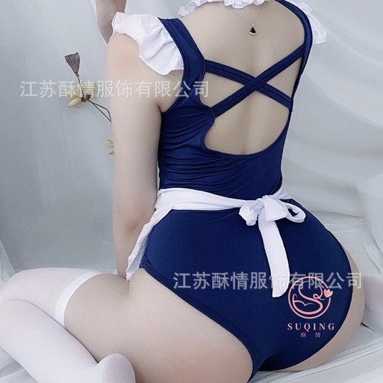 Woman wearing a sexy maid costume with a navy blue bodysuit, white apron, and ruffled sleeves.