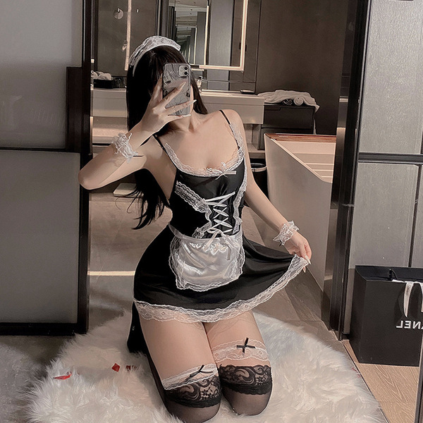 Sexy maid costume for women featuring a short black skirt with lace details, white apron, stockings, and headband. perfect fo...