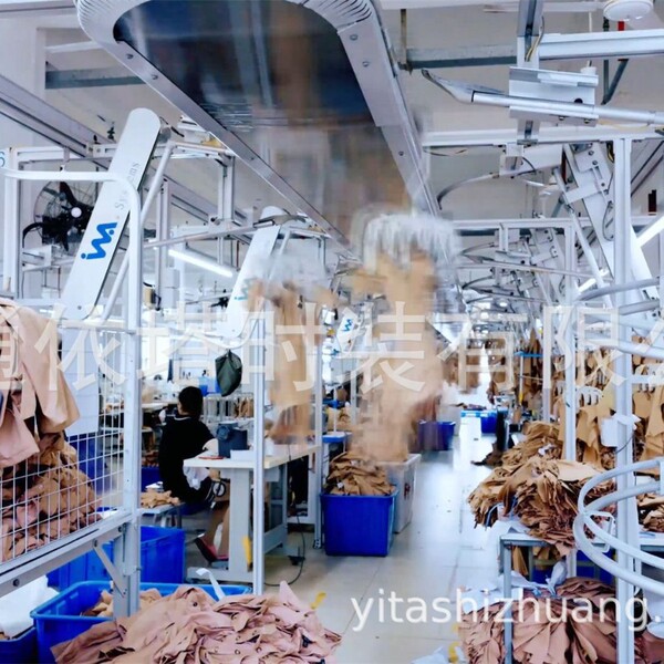 Factory setting with workers assembling skirts; focus on production line and materials.