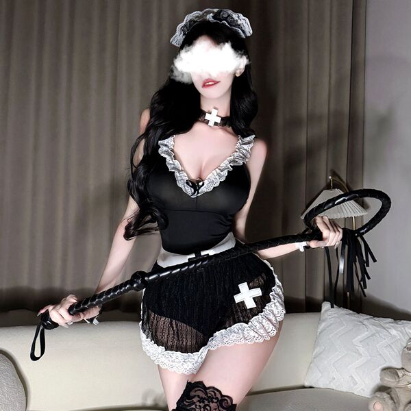 Woman in sexy nurse-maid lingerie set with apron, holding whip, for adult role play.