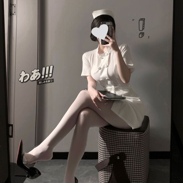 Sexy nurse costume set featuring a white dress with a bow-tie skirt, round neck design, and high heels, perfect for seductive...